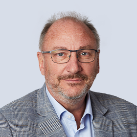 A portrait photograph of Brambles' Non-Executive Director, John Mullen