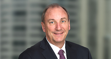 A portrait photograph of Brambles' Non-Executive Chairman, John Mullen