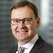 A portrait photograph of Brambles' Non-Executive Director, Scott Perkins